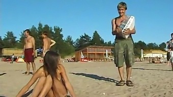 Young And Stunning Teen Indulges In Beach Fun In The Buff