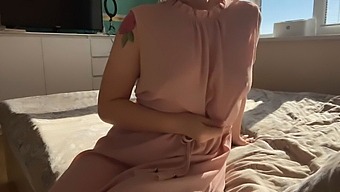 A Girl In A Pretty Pink Dress Indulges In Some Self-Pleasure